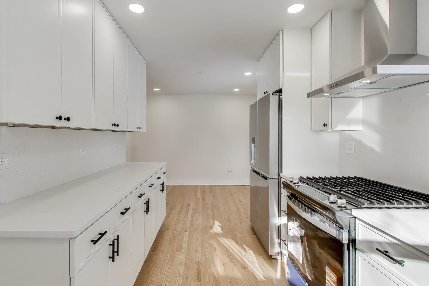 623 North Benton Street Palatine, IL 60067 - Photo 4 of 27 a kitchen with granite countertop a stove and a refrigerator
