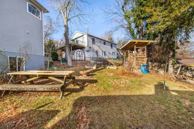 a view of a house with snow on the road