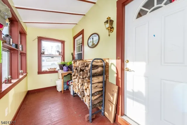 a view of an entryway with wooden floor
