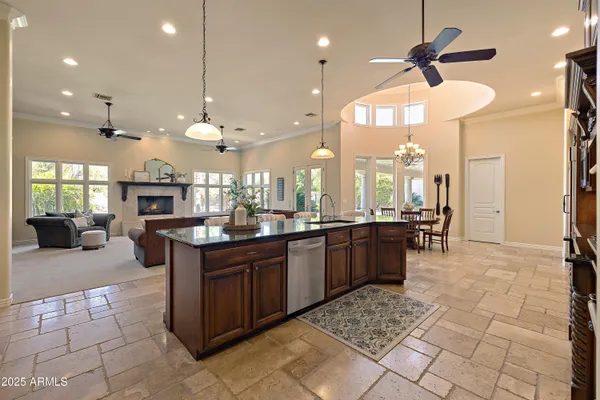 a kitchen with granite countertop cabinets and window