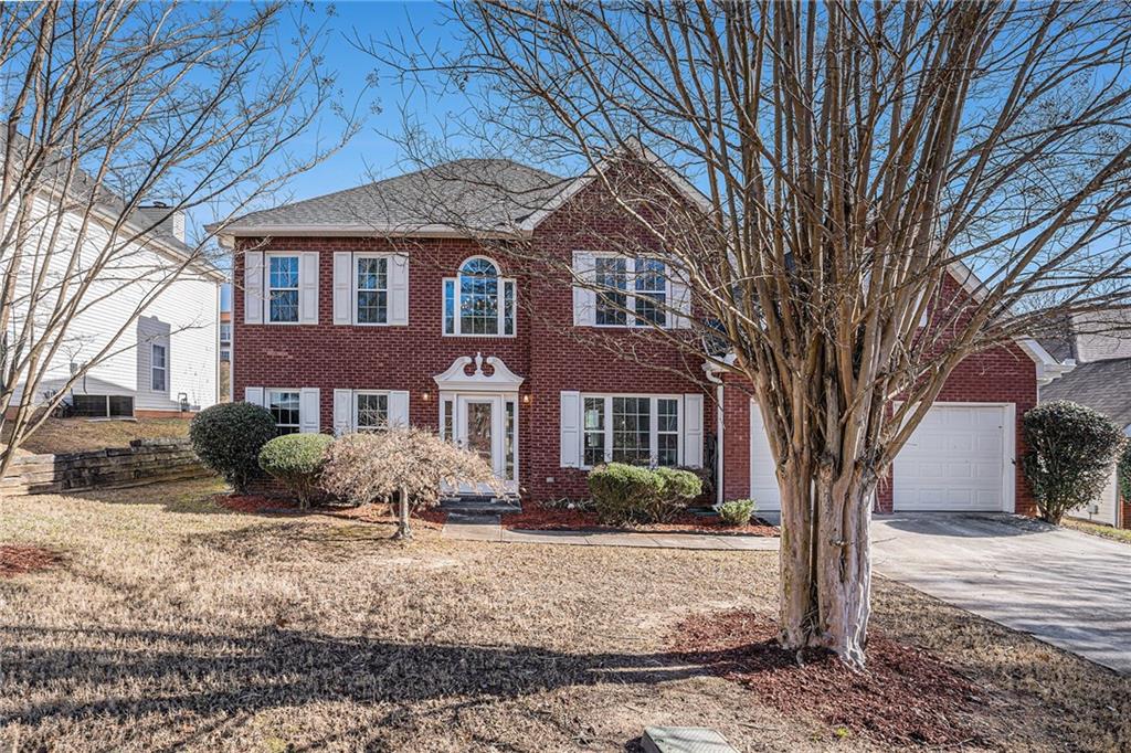 5631 Spring Mill Circle Lithonia, GA 30038 - Photo 1 of 1 a front view of a house with a yard