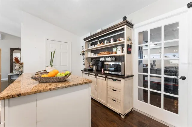 a kitchen with stainless steel appliances granite countertop a stove and a sink