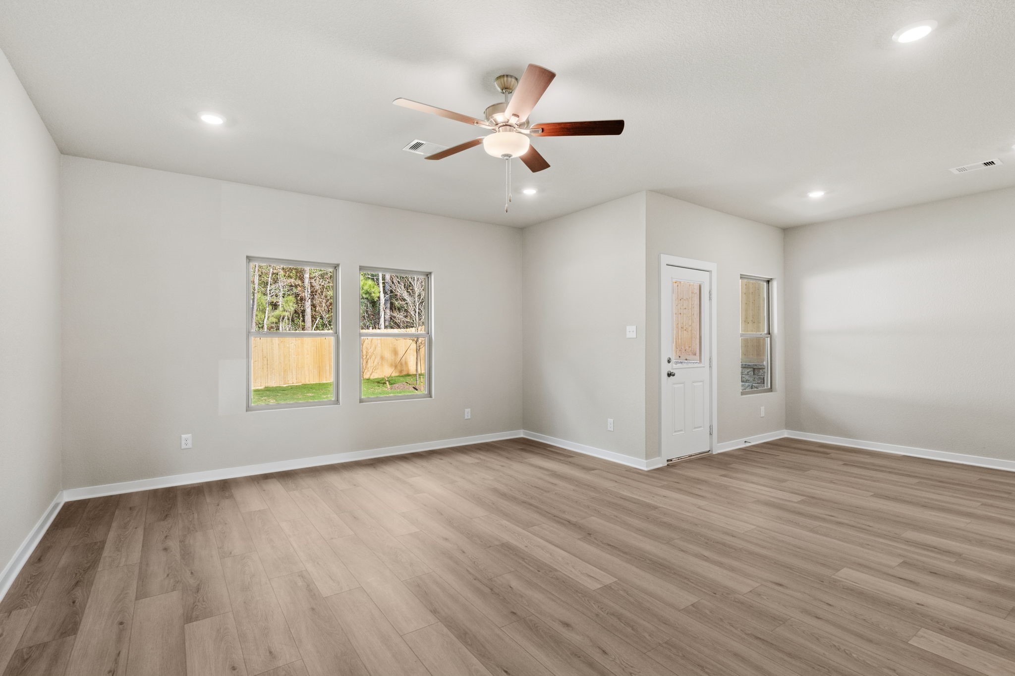 12343 Ridge Top Drive Conroe, TX 77304 - Photo 11 of 32 wooden floor in an empty room with a window