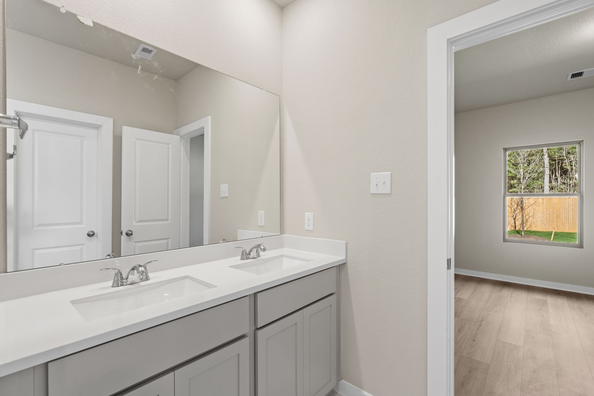 12343 Ridge Top Drive Conroe, TX 77304 - Photo 18 of 32 a bathroom with a sink and a mirror