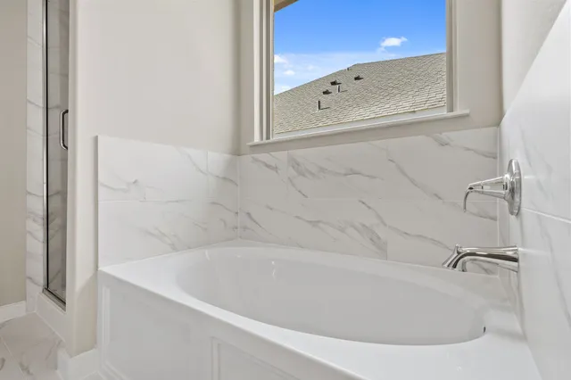 a bathroom with 2 sink and a mirror