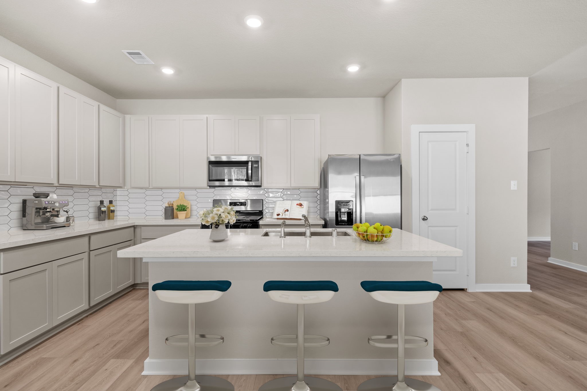 12343 Ridge Top Drive Conroe, TX 77304 - Photo 2 of 32 a kitchen with sink a stove and chairs with wooden floor