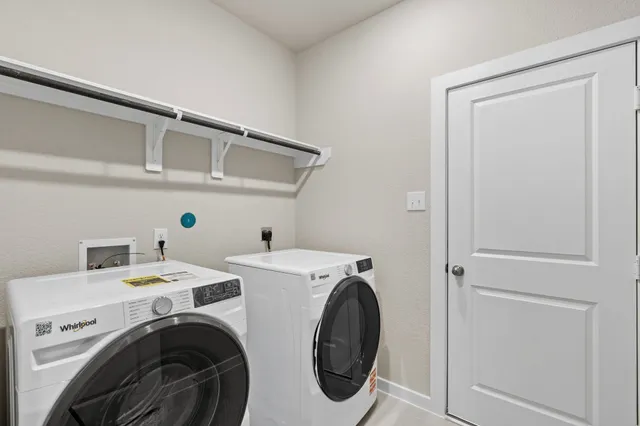 a view of a house with a big yard and large tree