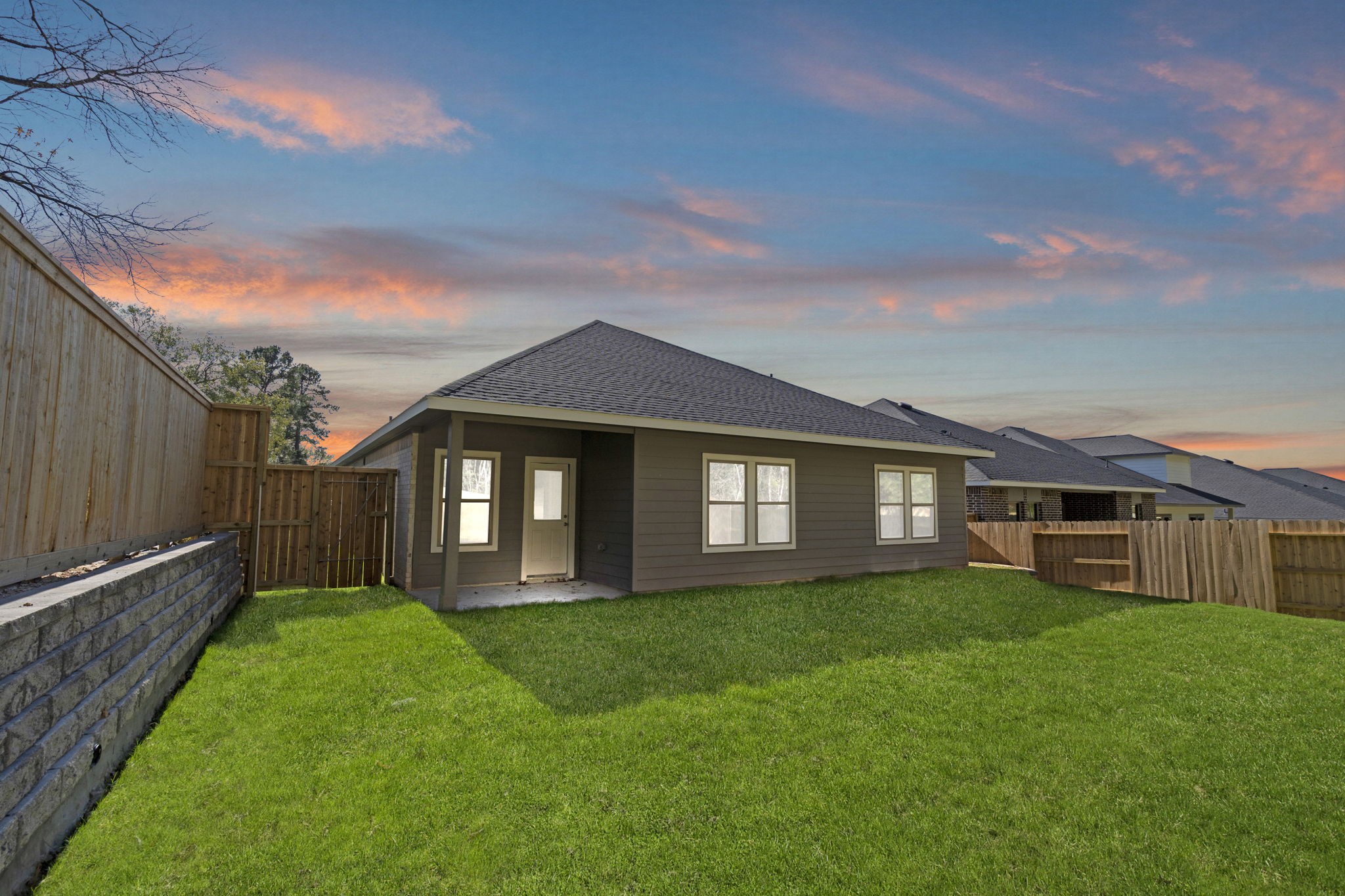 12343 Ridge Top Drive Conroe, TX 77304 - Photo 25 of 32 a view of a house with a big yard and large tree