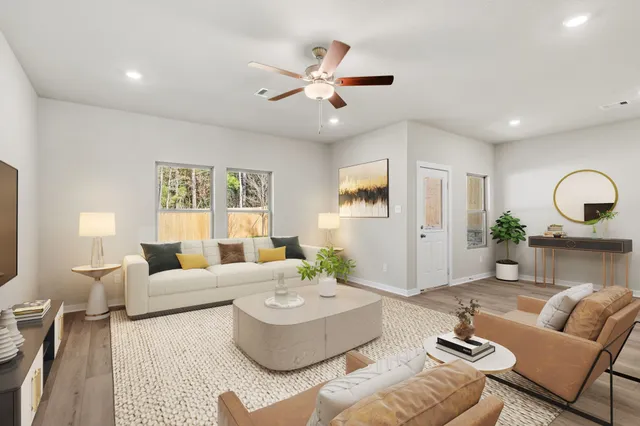 a living room with furniture and a large window