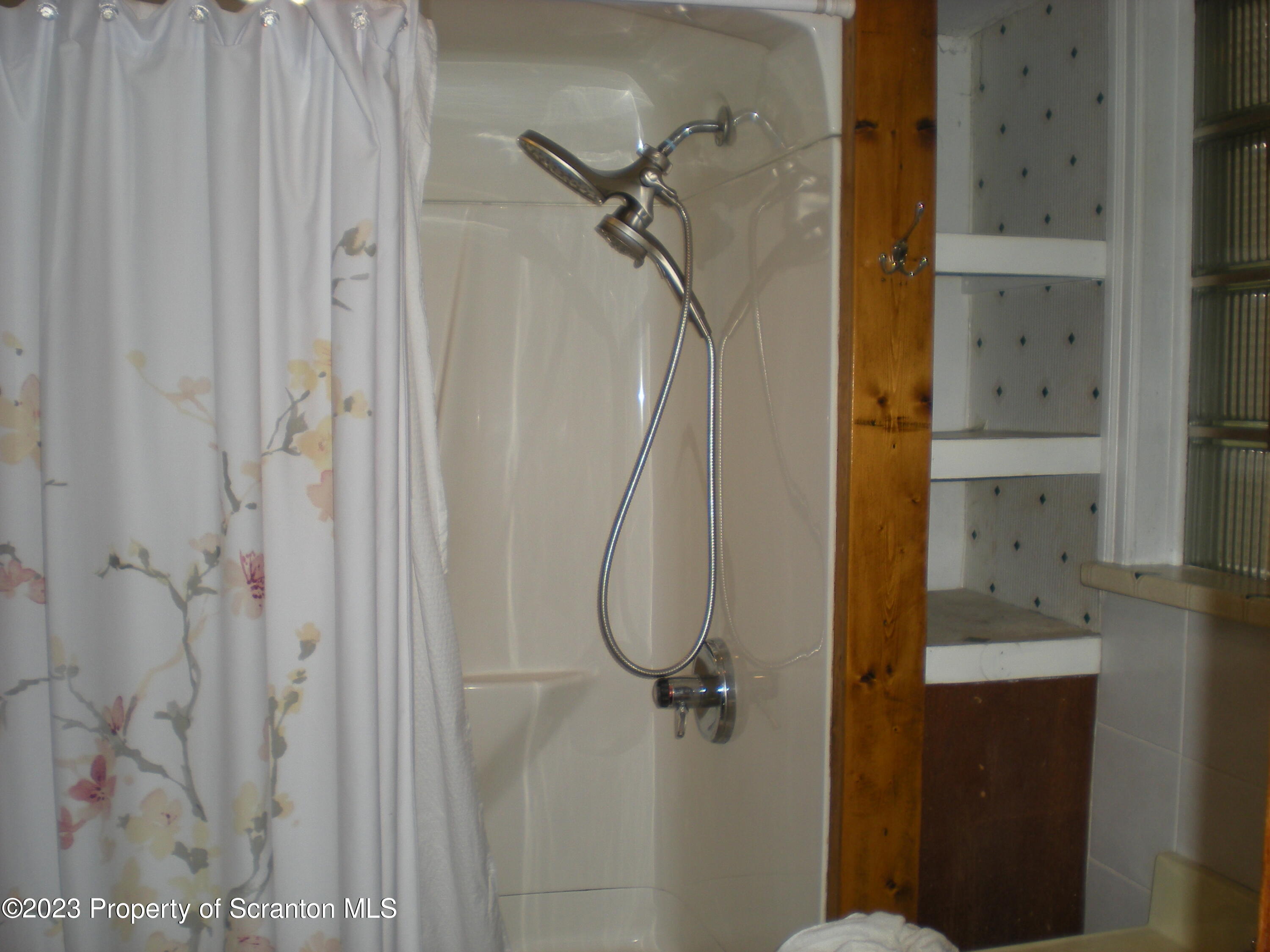 217 Ferdinand Street Scranton, PA 18508 - Photo 17 of 39 a bathroom with a glass shower door