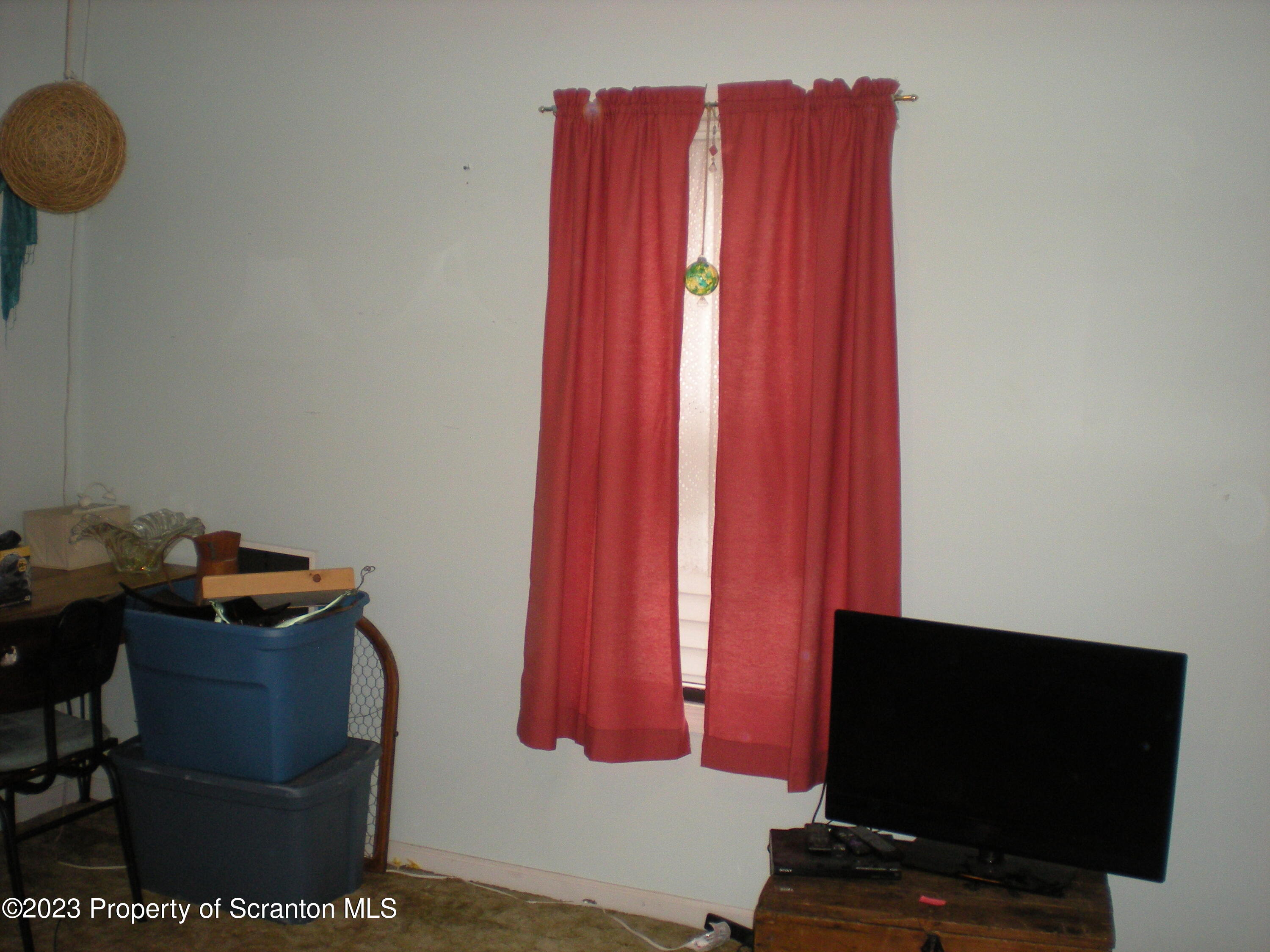 217 Ferdinand Street Scranton, PA 18508 - Photo 25 of 39 a living room with furniture and a flat screen tv