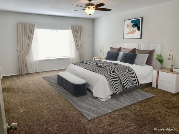 a bedroom with bed and window