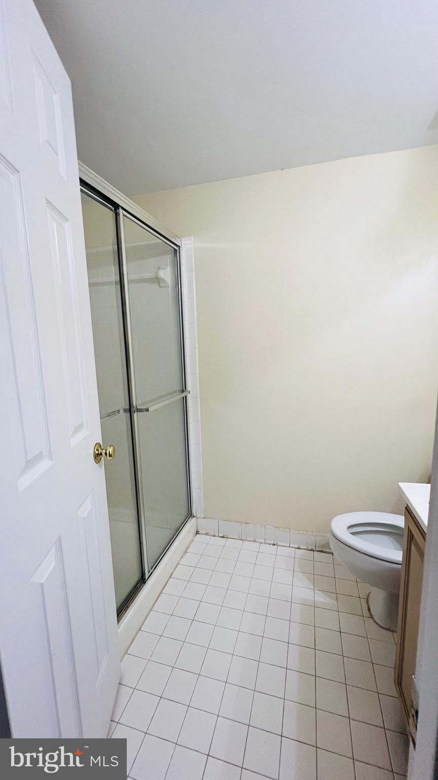 8035 Trevor Place Vienna, VA 22182 - Photo 16 of 48 a bathroom with a toilet and a shower