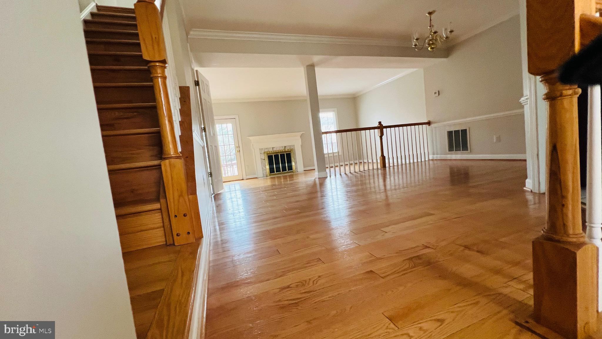 8035 Trevor Place Vienna, VA 22182 - Photo 19 of 48 a view of entryway and hall with wooden floor