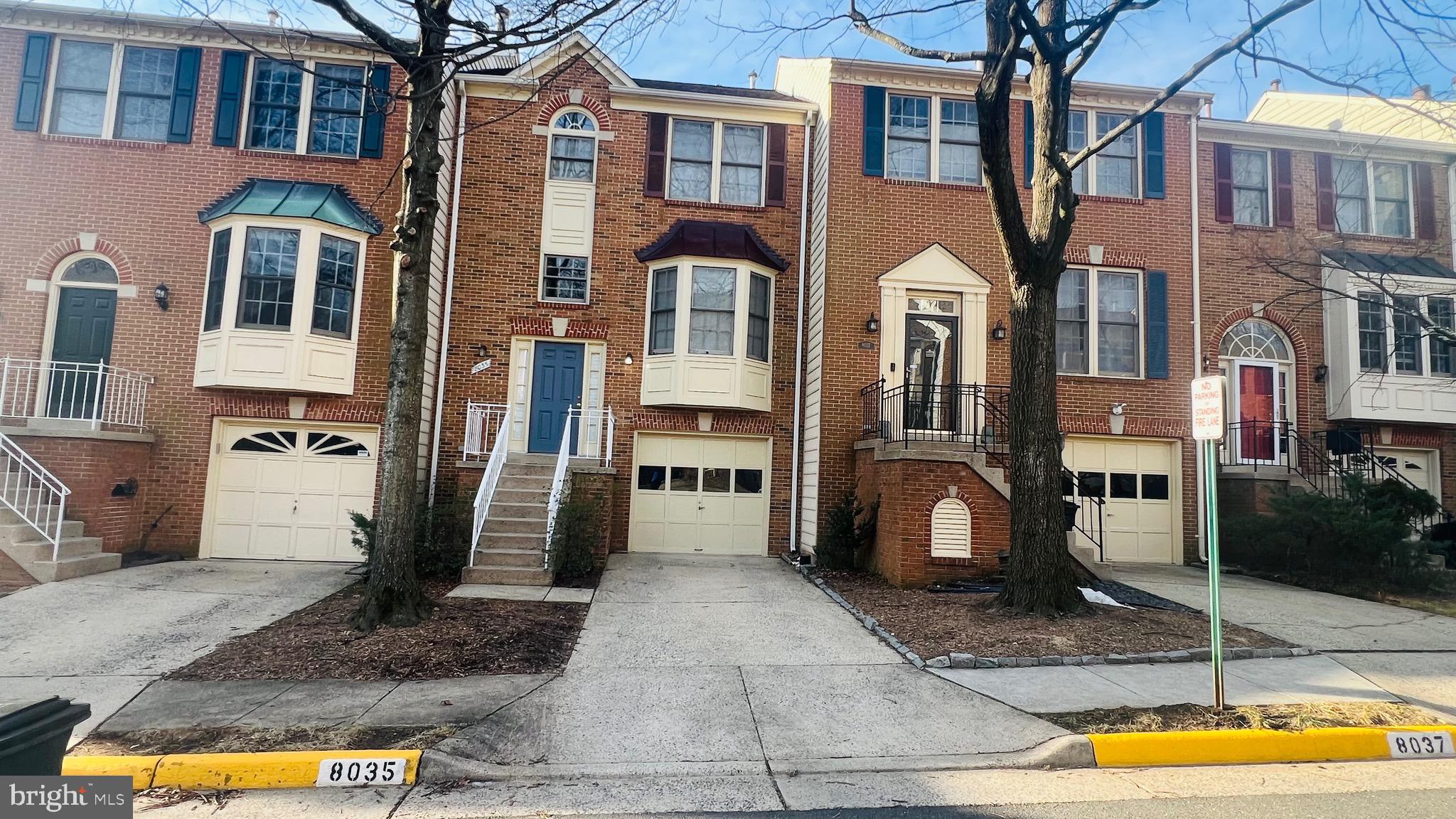 8035 Trevor Place Vienna, VA 22182 - Photo 2 of 48 a front view of a house with a yard
