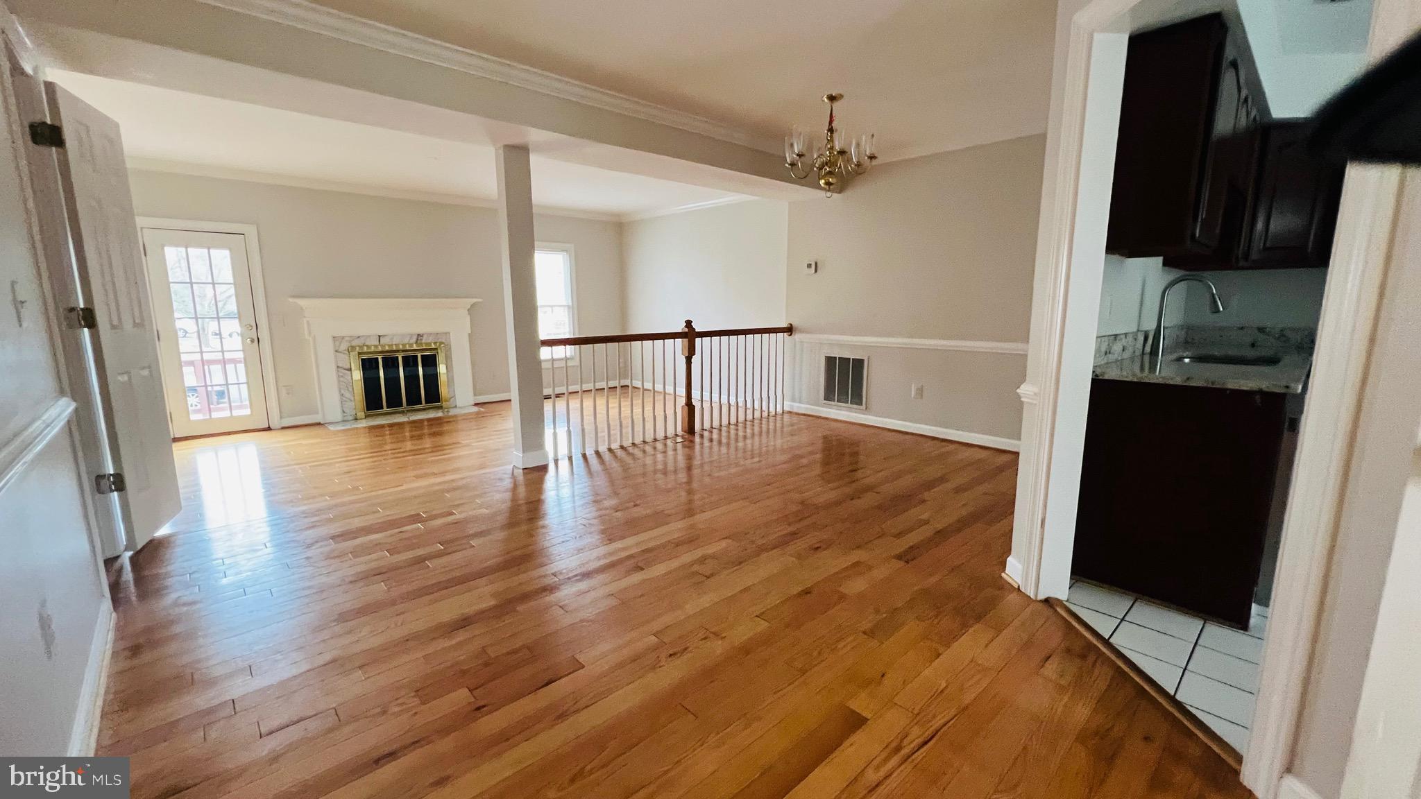 8035 Trevor Place Vienna, VA 22182 - Photo 21 of 48 wooden floor in an empty room with a window