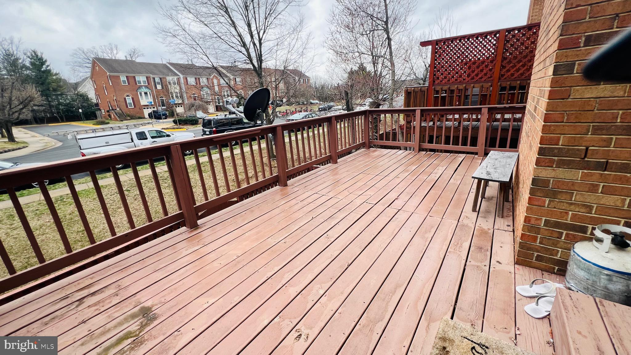 8035 Trevor Place Vienna, VA 22182 - Photo 35 of 48 a view of balcony with wooden floor and fence