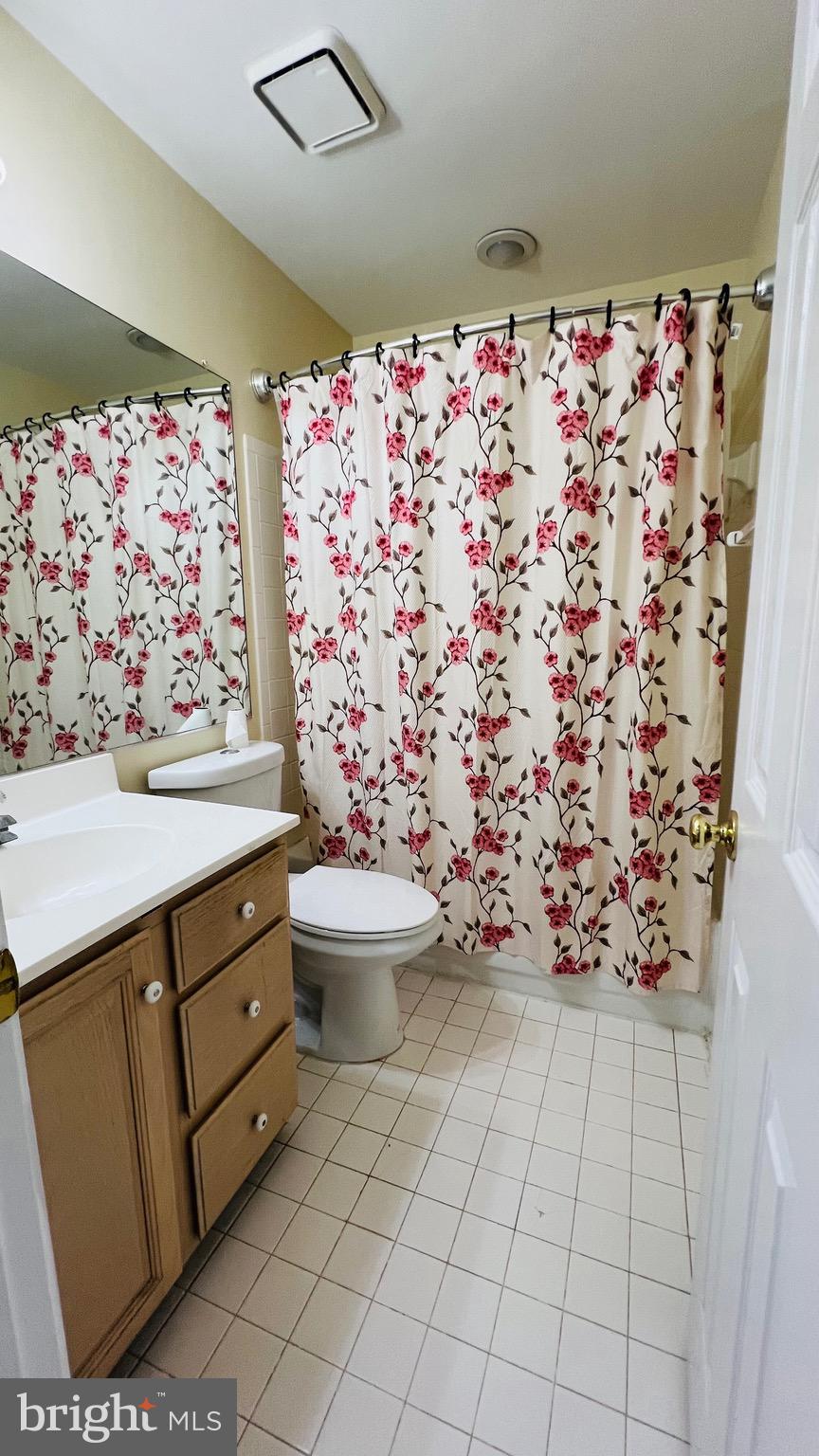 8035 Trevor Place Vienna, VA 22182 - Photo 41 of 48 a bathroom with a sink toilet and shower