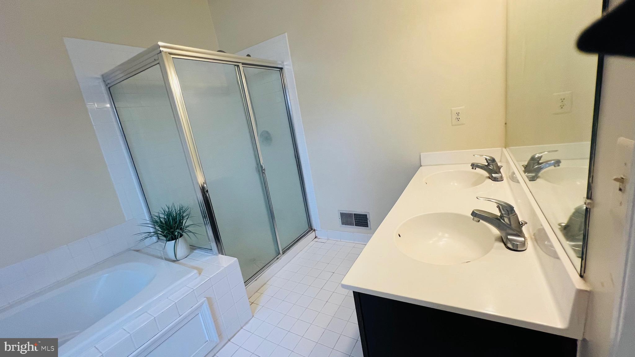 8035 Trevor Place Vienna, VA 22182 - Photo 45 of 48 a bathroom with a sink and tub