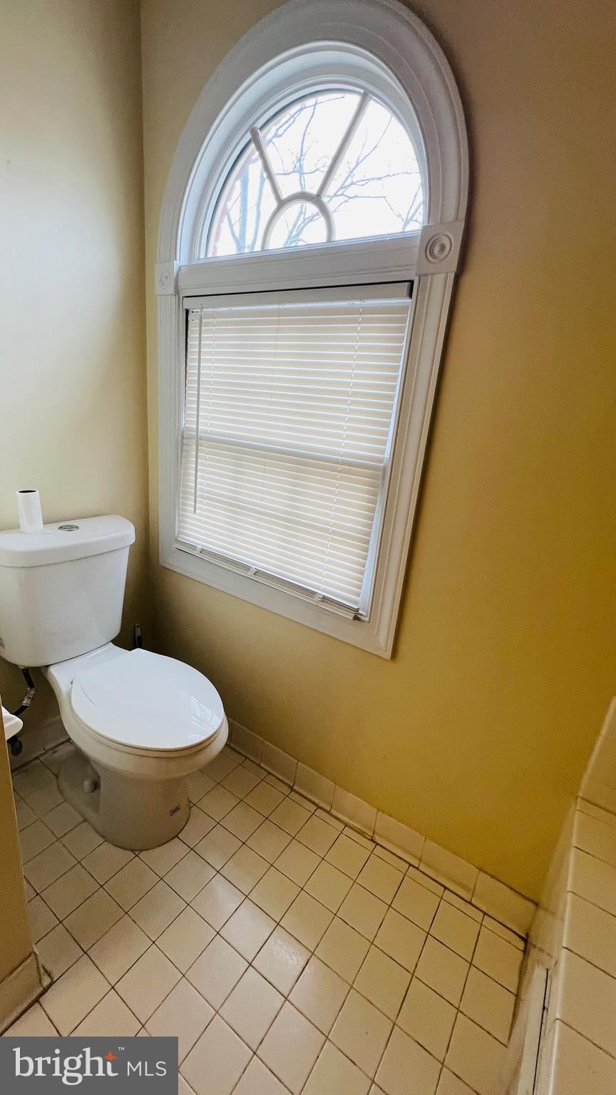 8035 Trevor Place Vienna, VA 22182 - Photo 48 of 48 a bathroom with a toilet a sink and a vanity