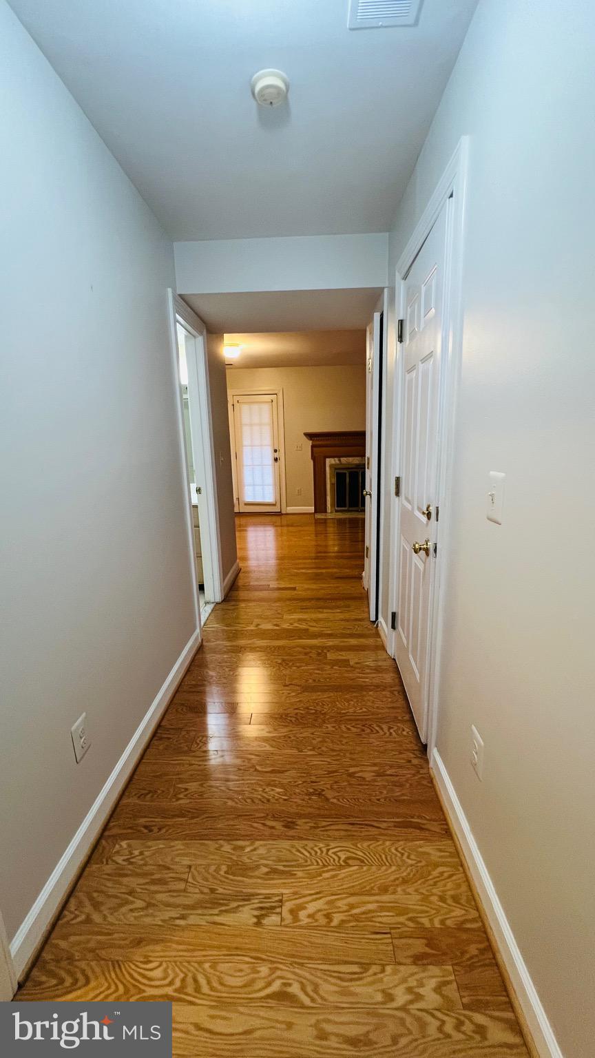 8035 Trevor Place Vienna, VA 22182 - Photo 10 of 48 a view of a room with wooden floor