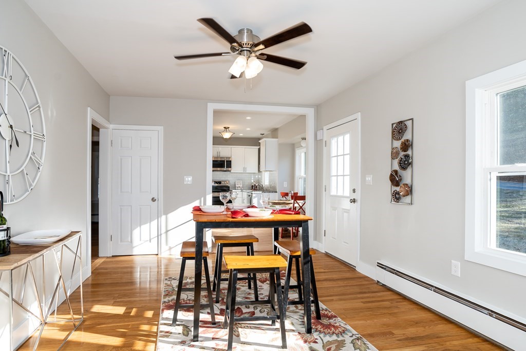 252 Old Warren Road Palmer, MA 01069 - Photo 11 of 29 a view of a dining room with furniture and wooden floor