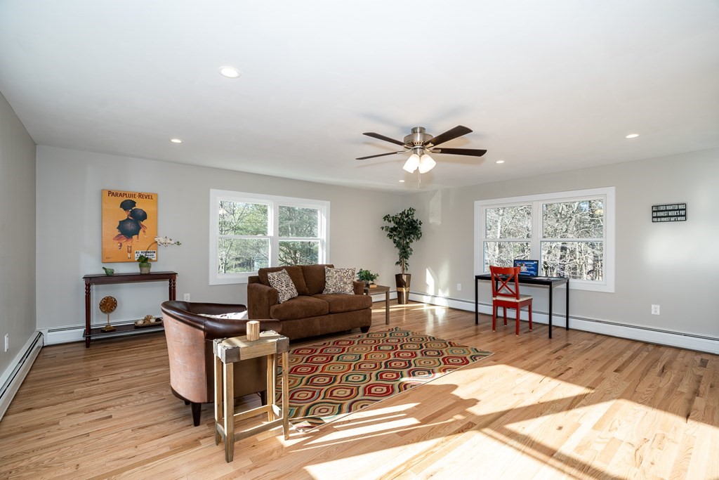 252 Old Warren Road Palmer, MA 01069 - Photo 12 of 29 a living room with furniture a window and a flat screen tv