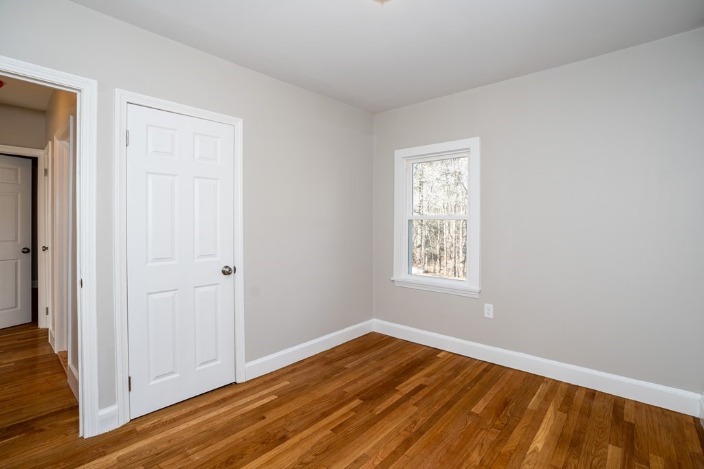 252 Old Warren Road Palmer, MA 01069 - Photo 18 of 29 a view of empty room with wooden floor and fan