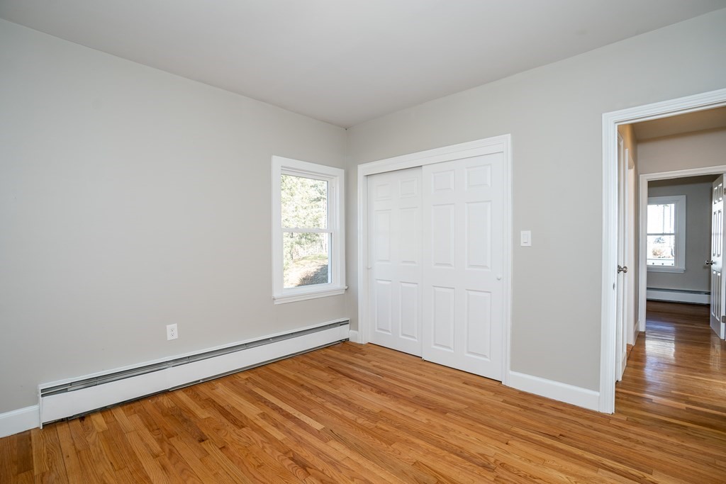 252 Old Warren Road Palmer, MA 01069 - Photo 20 of 29 wooden floor in an empty room with a window
