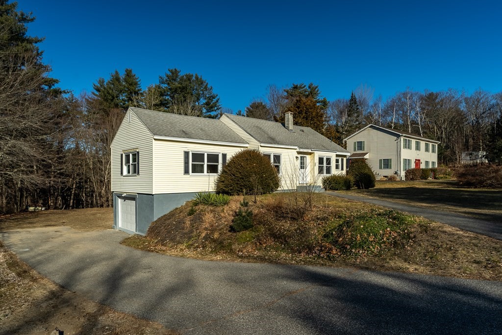 252 Old Warren Road Palmer, MA 01069 - Photo 25 of 29 a front view of a house with a yard
