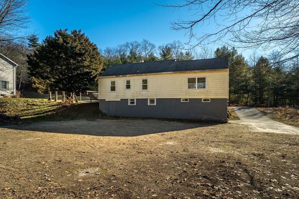 252 Old Warren Road Palmer, MA 01069 - Photo 28 of 29 a view of a house with a yard