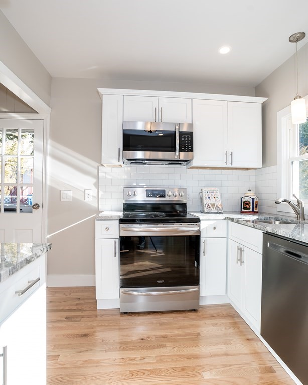 252 Old Warren Road Palmer, MA 01069 - Photo 4 of 29 a kitchen with stainless steel appliances granite countertop a stove and a sink
