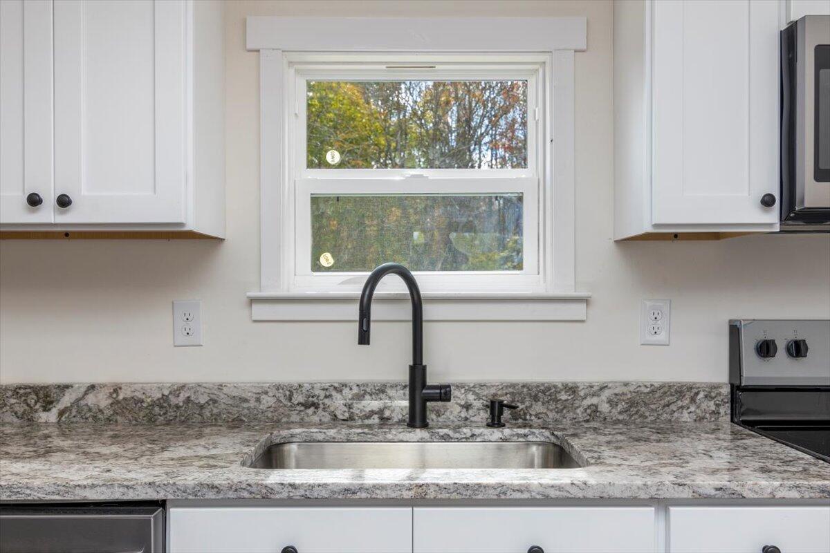 36 Nutmeg Lane Penhook, VA 24137 - Photo 11 of 37 a kitchen with granite countertop a sink and a window