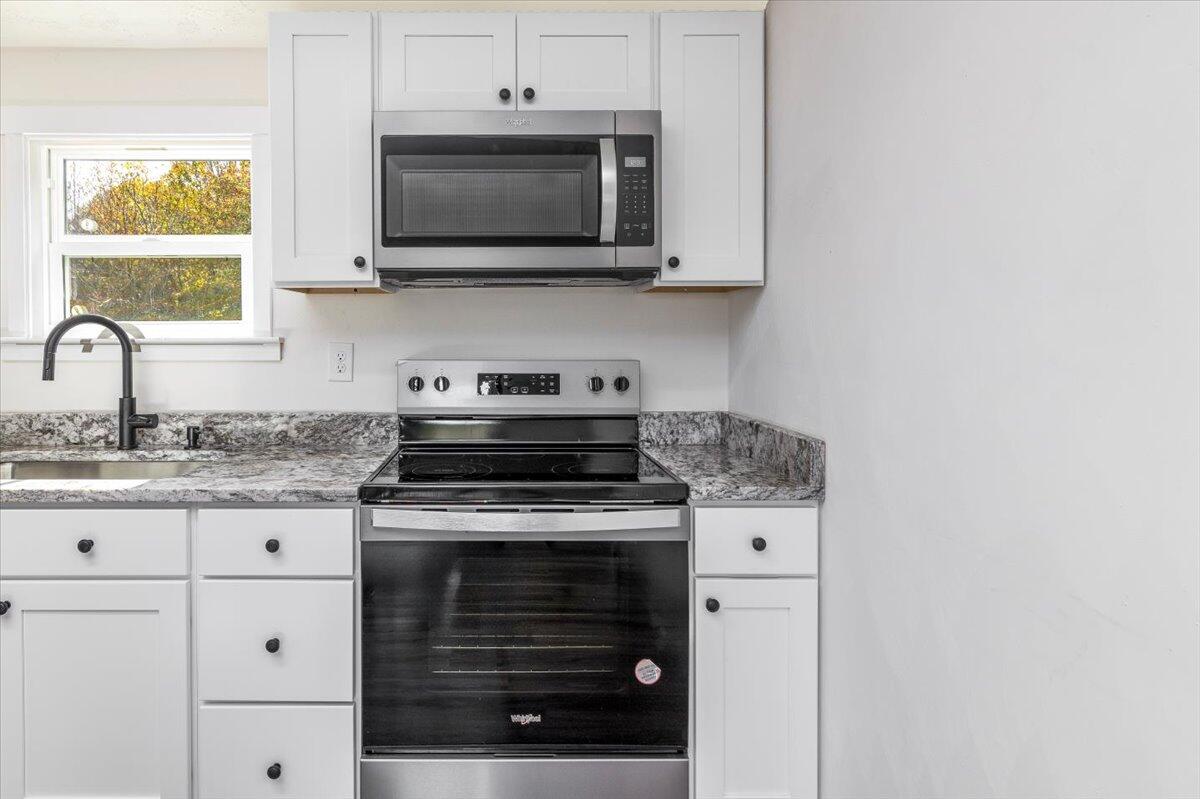 36 Nutmeg Lane Penhook, VA 24137 - Photo 12 of 37 a stove top oven sitting inside of a kitchen