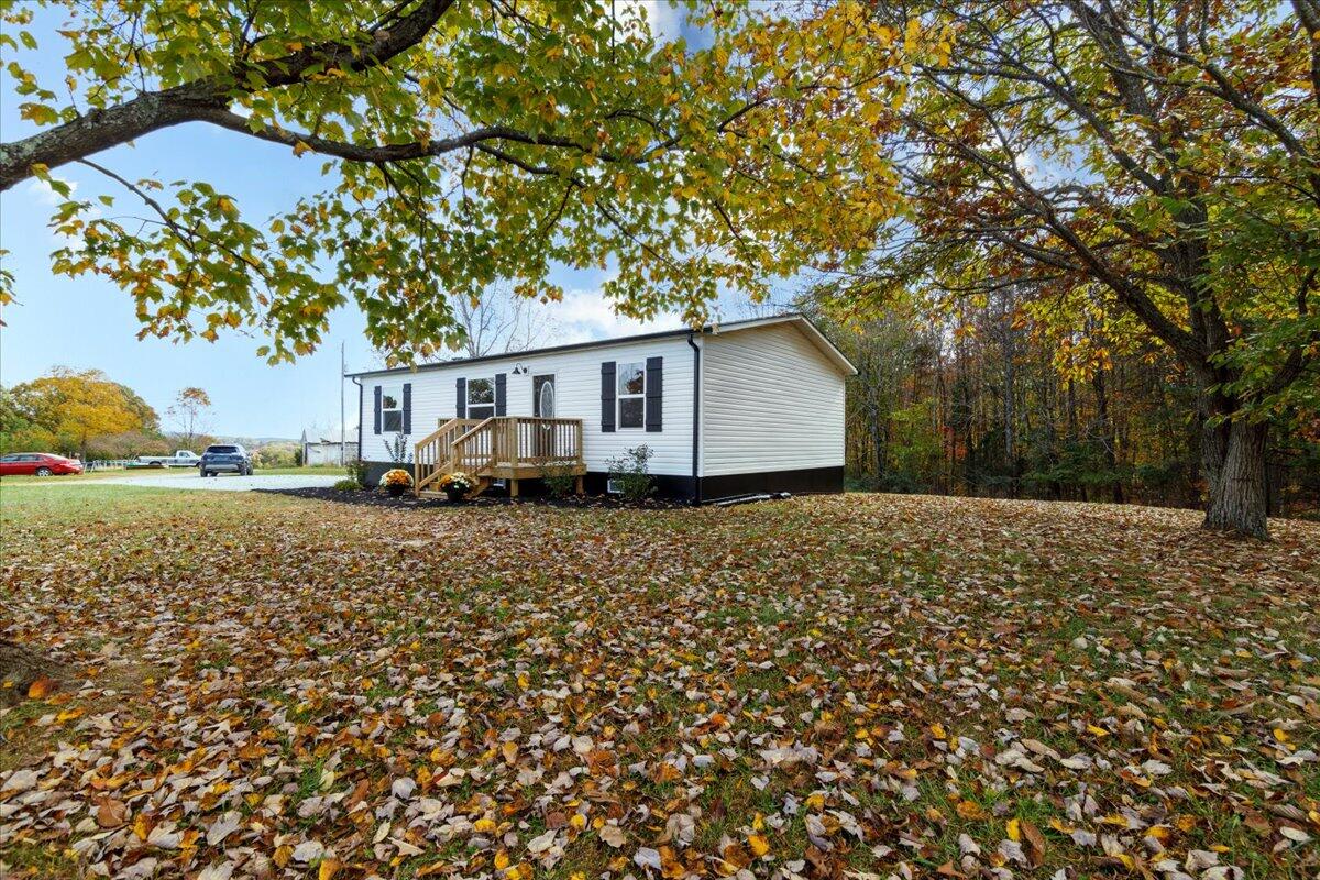 36 Nutmeg Lane Penhook, VA 24137 - Photo 27 of 37 a house with trees in front of it