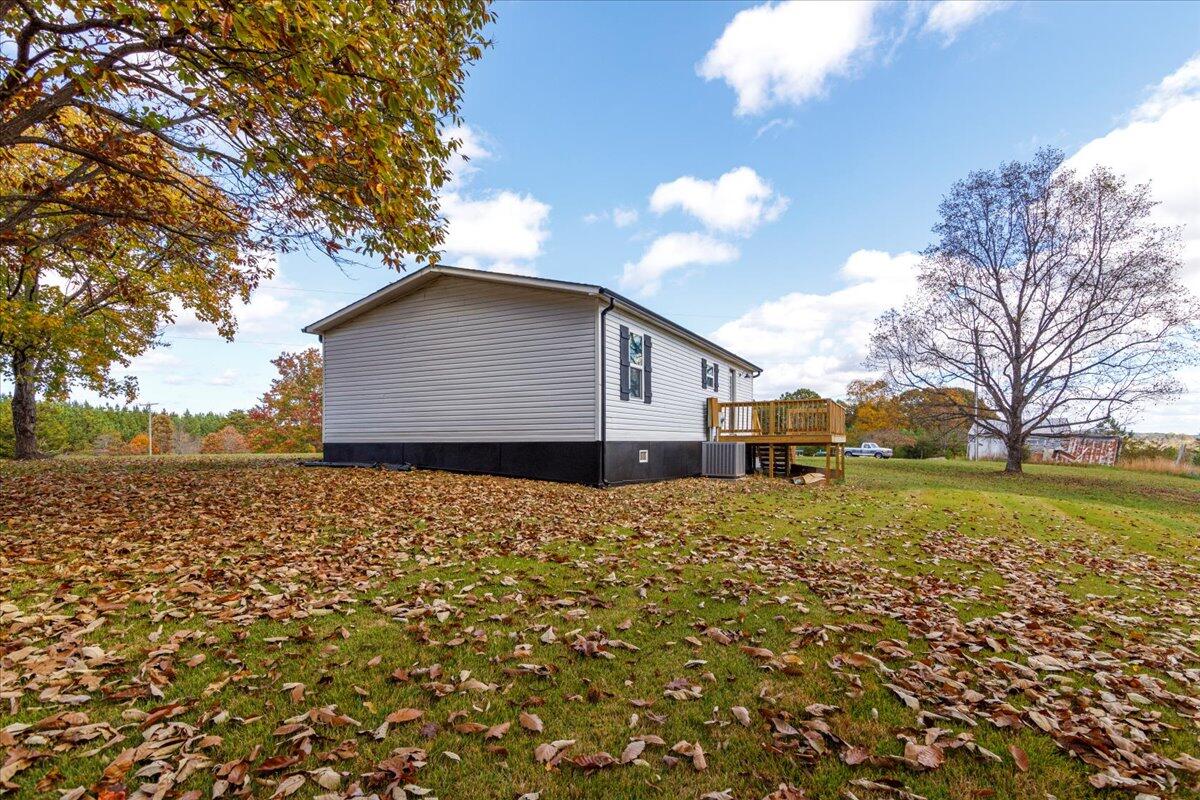 36 Nutmeg Lane Penhook, VA 24137 - Photo 30 of 37 a backyard of a house with large trees