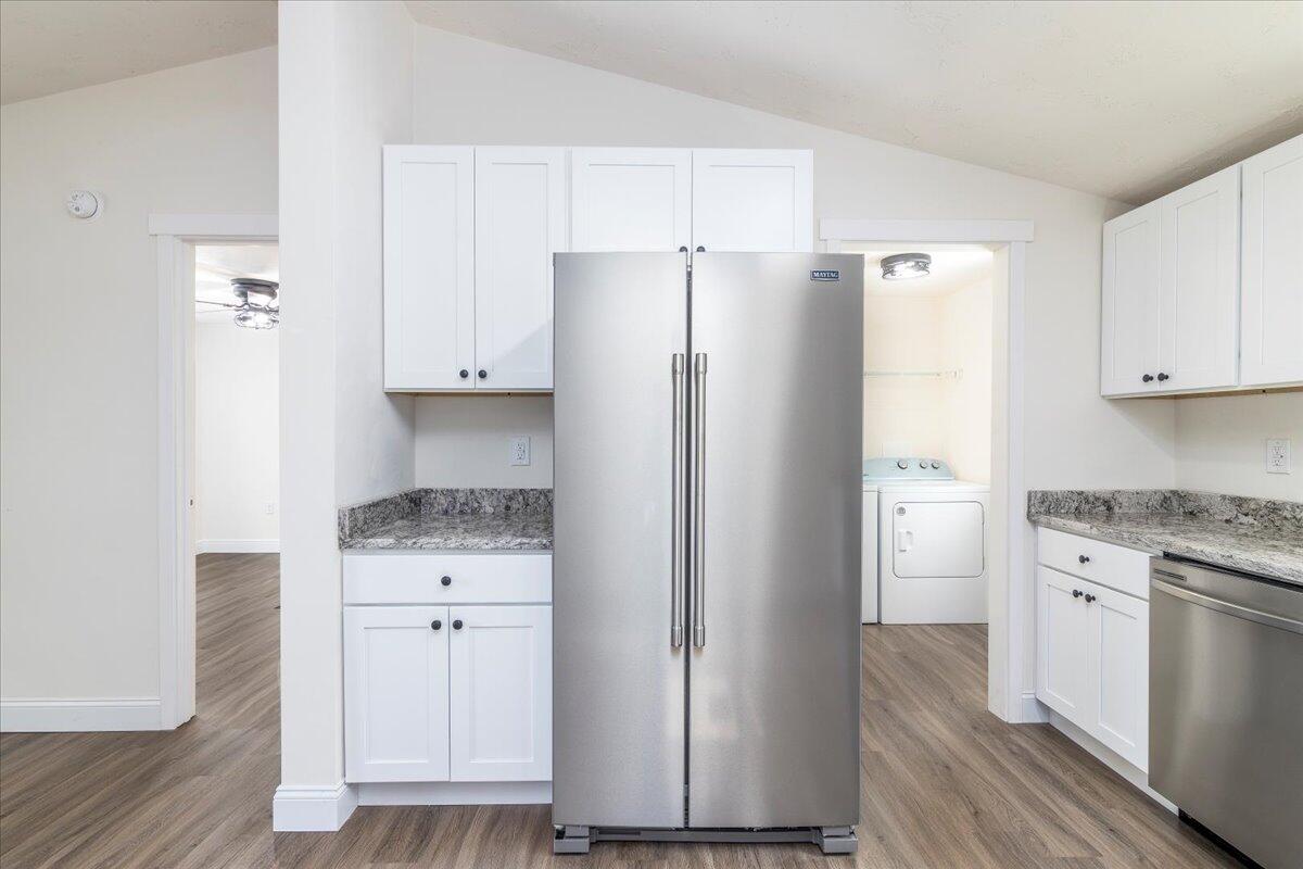 36 Nutmeg Lane Penhook, VA 24137 - Photo 10 of 37 a kitchen with granite countertop white cabinets and refrigerator