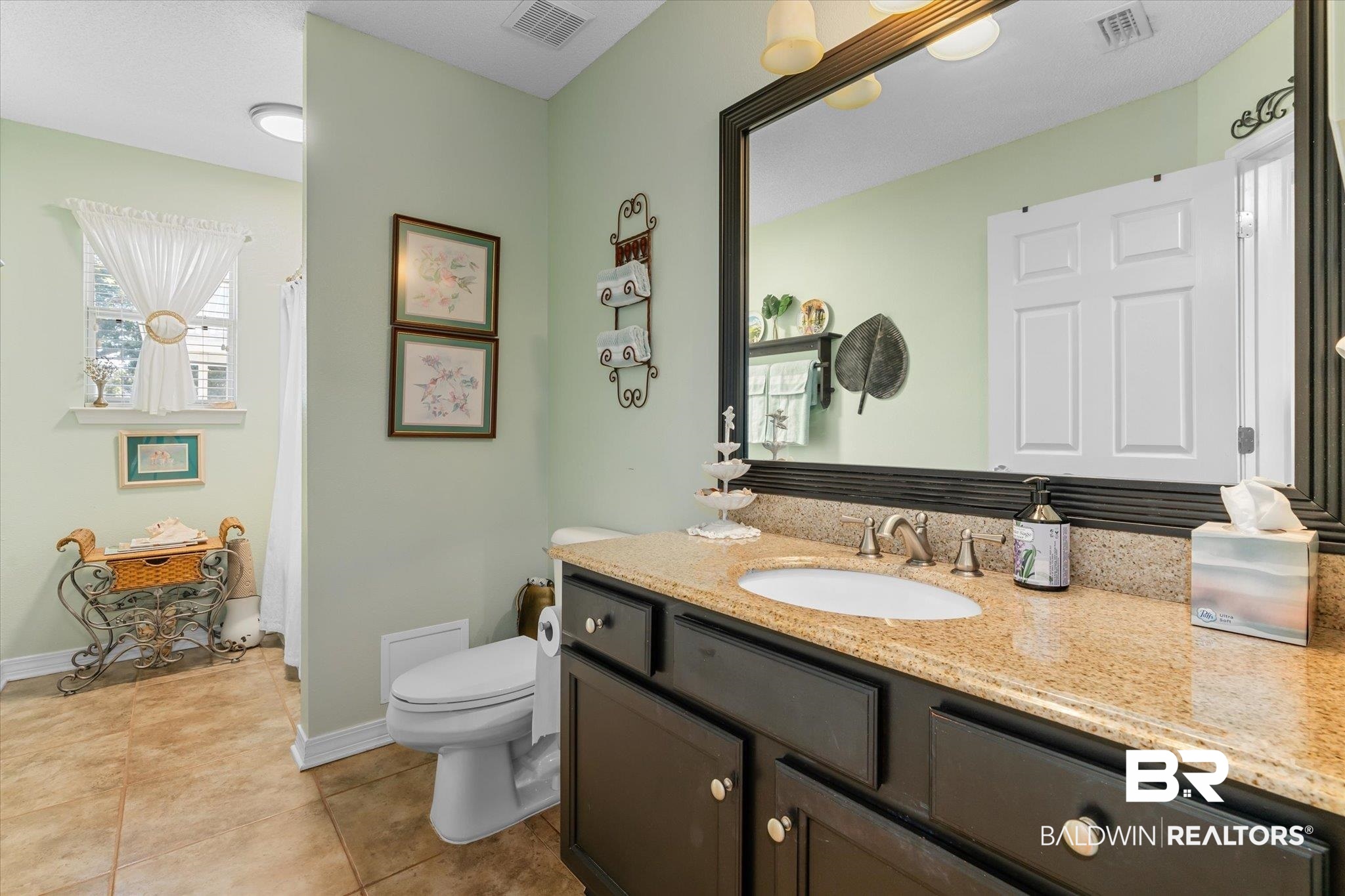 356 Collinwood Loop Foley, AL 36535 - Photo 7 of 21 Bathroom featuring toilet, vanity, and tile patterned floors