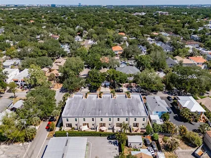 an aerial view of multiple house with a yard