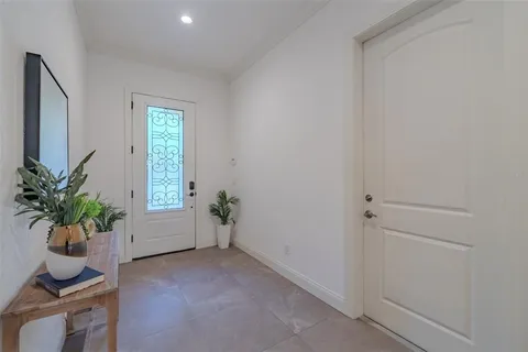 a view of an empty room and a window
