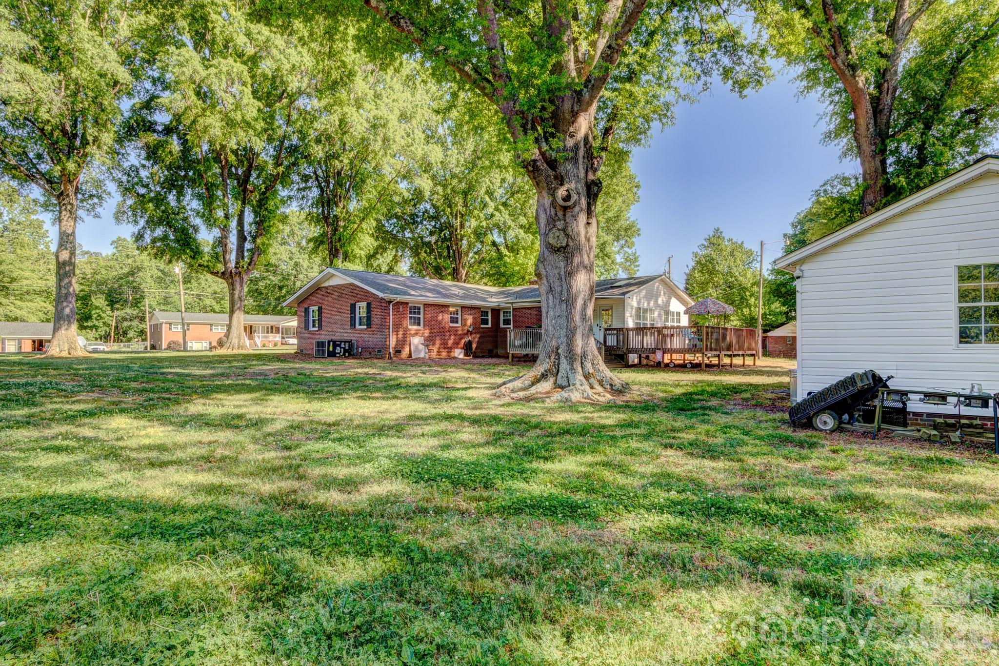 113 Delview Drive Cherryville, NC 28021 - Photo 20 of 26 a house view with a sitting space and garden