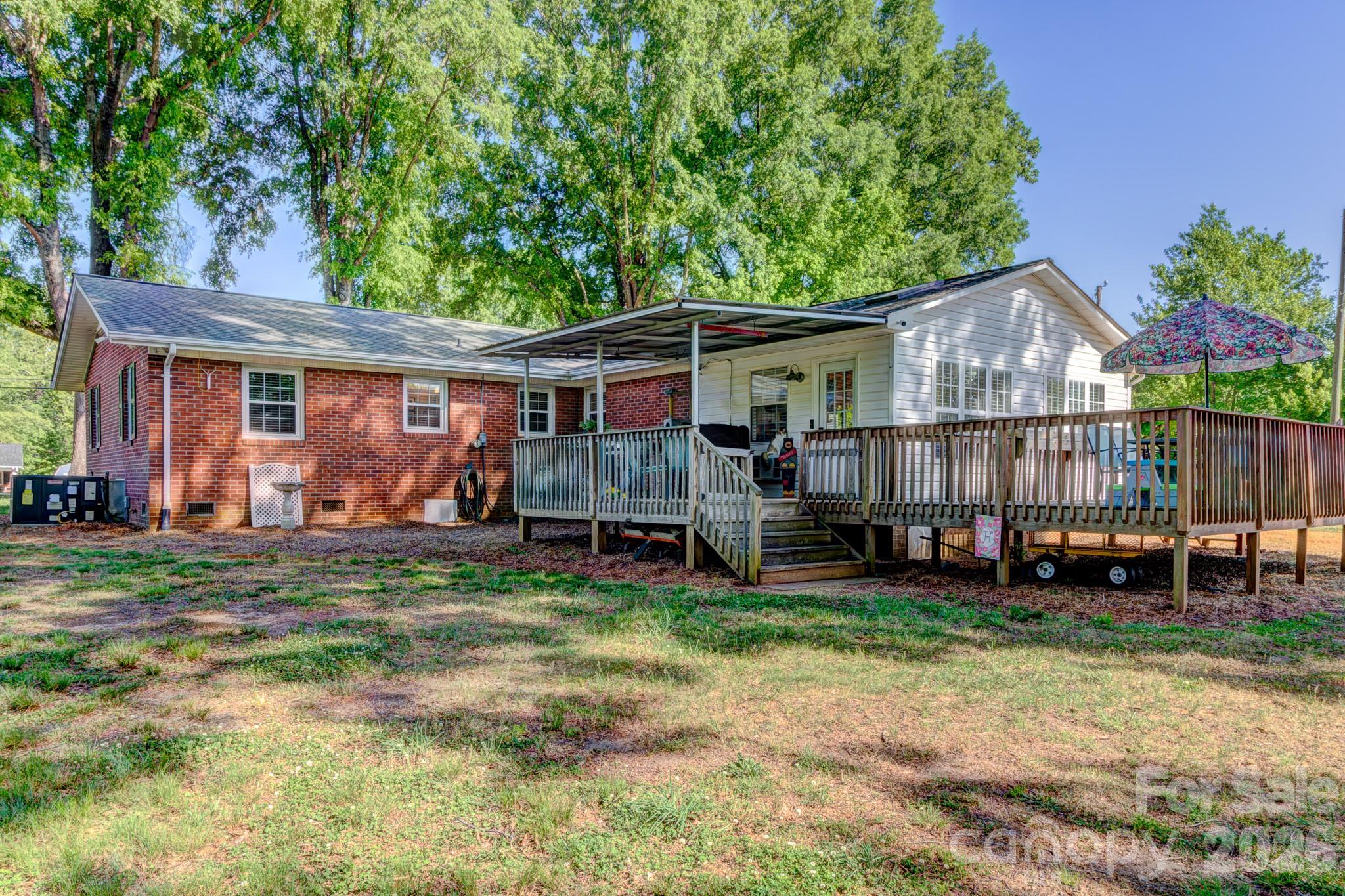 113 Delview Drive Cherryville, NC 28021 - Photo 23 of 26 a view of a house with a yard and sitting area