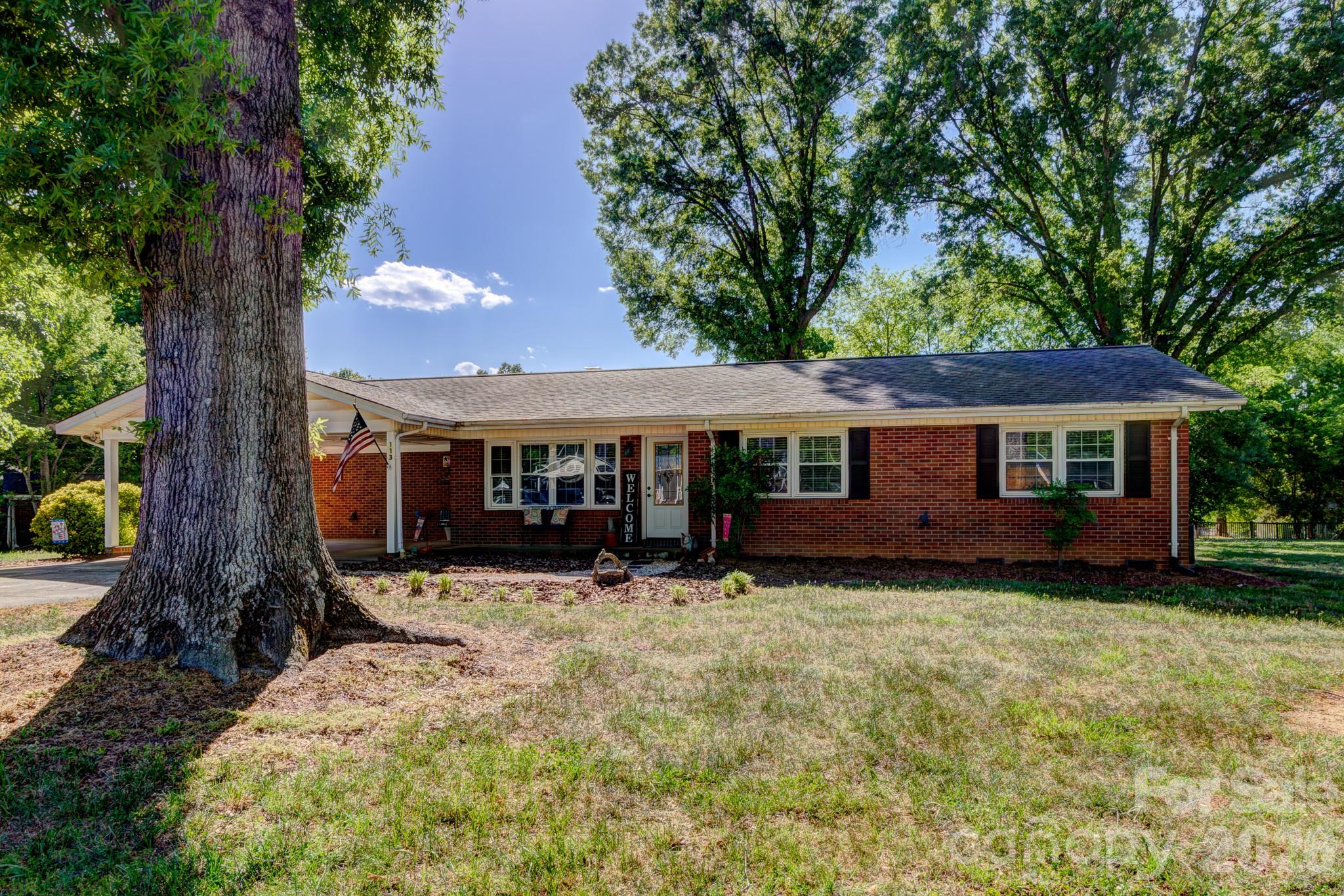 113 Delview Drive Cherryville, NC 28021 - Photo 26 of 26 a front view of house with yard outdoor seating and barbeque oven