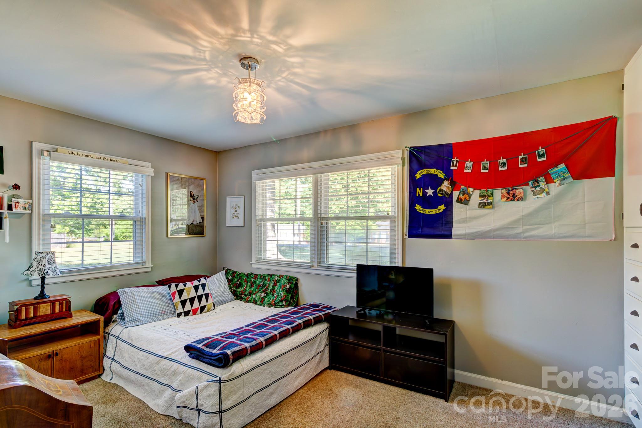 113 Delview Drive Cherryville, NC 28021 - Photo 10 of 26 a living room with furniture a flat screen tv and a window