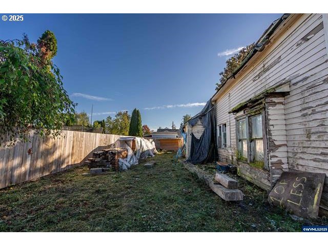 109 South Trade Street Amity, OR 97101 - Photo 7 of 8 a view of a backyard with plants and a patio