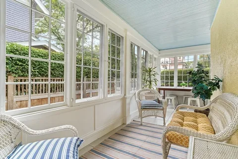a living room with furniture and windows