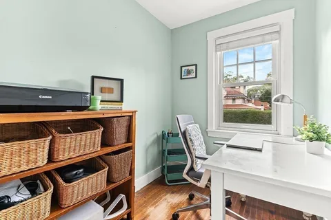 a work room with furniture and window
