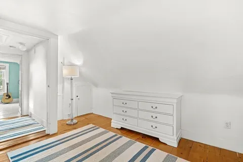 a view of a dresser with wooden floor