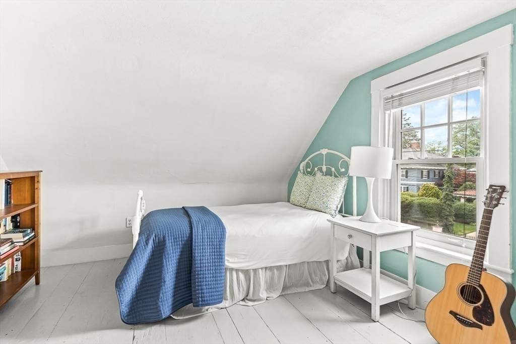 104 Church Street Winchester, MA 01890 - Photo 25 of 42 a bedroom with a bed and glass door