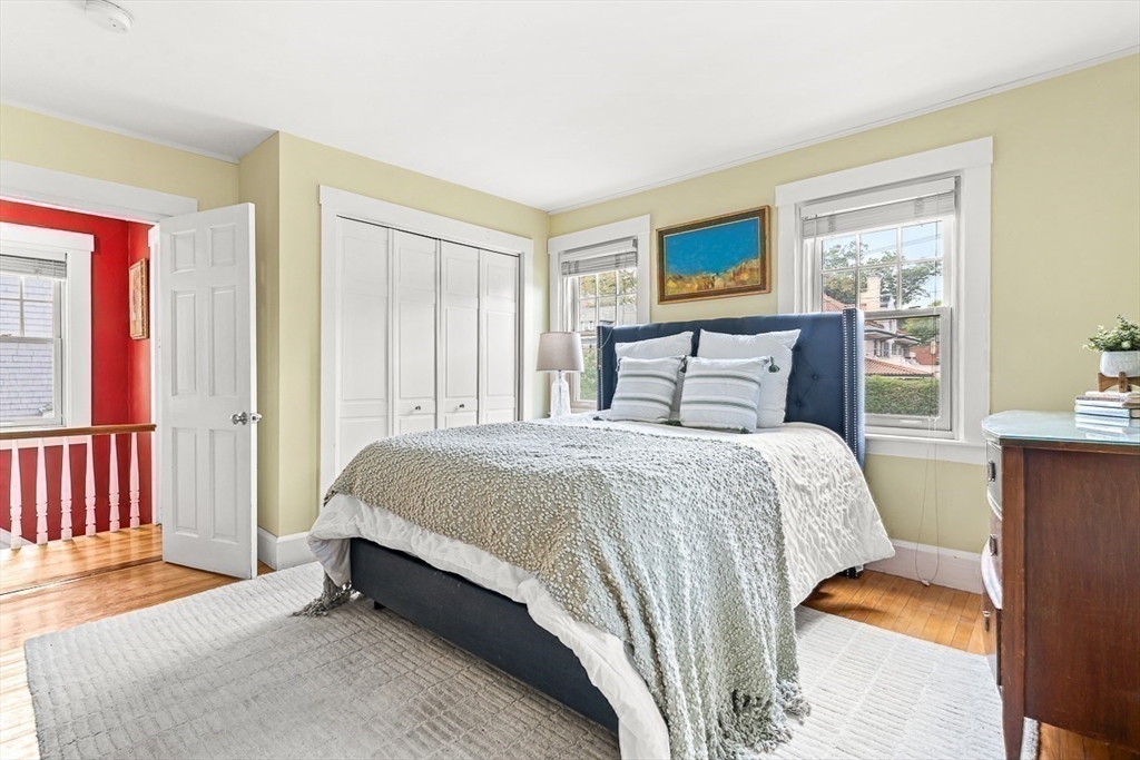 104 Church Street Winchester, MA 01890 - Photo 27 of 42 a bedroom with a bed and wooden floor